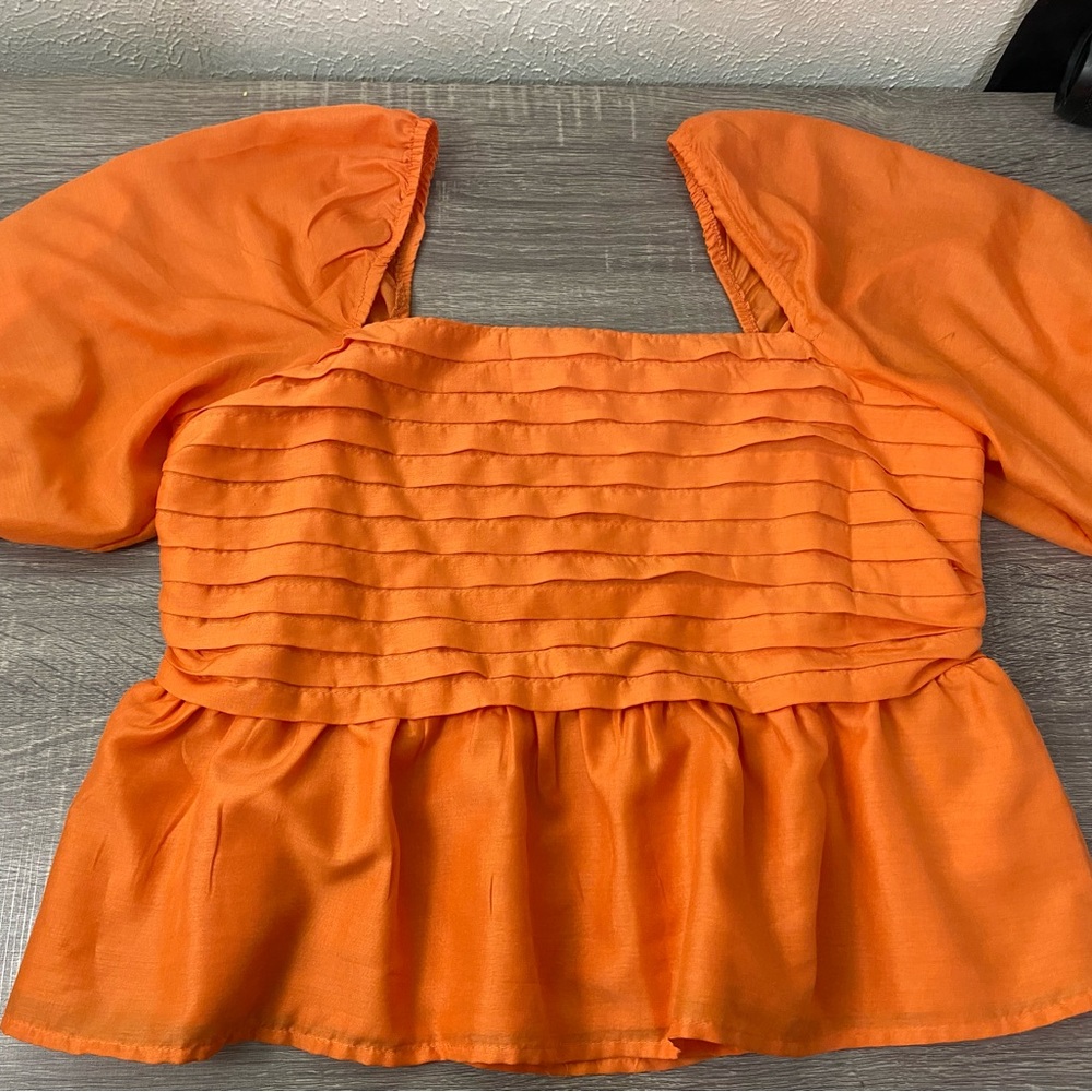 Size Large Orange Beyond Words crop top with 
Half length puffy sleeves